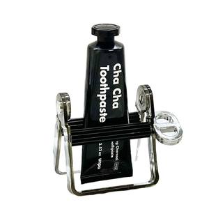 Dispensador de pasta de dientes: dispositivo fijo doméstico con mecanismo giratorio y exprimidor simple - Product Image 1