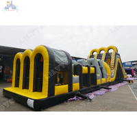Parcours d'obstacles gonflable géant commercial avec toboggan pour enfants et adultes, idéal pour événements extérieurs, jeu de défi noir et jaune, OEM disponible