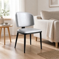 Chaise de salle à manger moderne rembourrée en gros avec assise gris clair et pieds en métal noir mat pour hôtels et appartements