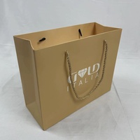 Emballage cadeau personnalisable en or mat avec poignée torsadée en corde, respectueux de l'environnement, pour les boutiques de marque et les magasins de détail