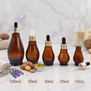 Flacon compte-gouttes <span class=keywords><strong>en</strong></span> verre ambré <span class=keywords><strong>en</strong></span> forme de <span class=keywords><strong>gourde</strong></span> de 10 ml à 100 ml, conteneur pour huile essentielle et sérum, emballage personnalisé pour soins de la <span class=keywords><strong>peau</strong></span> avec bouchon à vis et logo sur mesure - Product Image 1