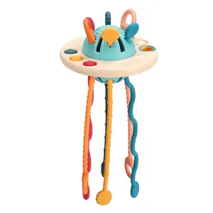 Hot sale flying saucer spacecraft hand-held baby fun pumping exercise sensory perception toys silicone pull string activity