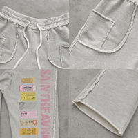 Pantalon de survêtement ample gris chiné en molleton de coton, coupe large, avec cordon de serrage, poches plaquées et imprimé graphique, style streetwear décontracté, OEM ODM