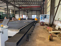 Máquina de corte por láser de fibra de alta potencia para riel de tierra de pórtico de 30000W con cabezal oscilante para industrias de fabricación de estructuras de acero