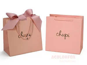 लक्जरी आभूषण शॉपिंग पेपर बैग कस्टम प्रिंट लोगो गोल्ड फ़ॉइल्ड मिनी प्यारा गुलाबी पेपर उपहार बैग हैंडल रिबन क्लोजर के साथ