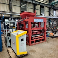 Machine de fabrication de blocs de béton hydraulique entièrement automatique QT4-15 avec système anti-vibration à faible bruit pour la production de briques creuses