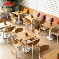 Chaise de table à manger commerciale de style industriel avec cadre métallique empilable et assise ergonomique en contreplaqué courbé pour cafétéria d'école ou universitaire