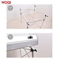 Table de camping pliante rectangulaire en aluminium légère et moderne WOQI, avec sac de transport, pour l'ameublement extérieur