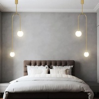 Lustre suspendu de chambre à coucher de luxe minimaliste moderne nordique, lampe créative en verre en forme de boule, LED dorée en U, très tendance