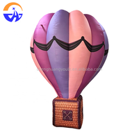 Modèle de montgolfière gonflable géante personnalisée et colorée avec panier pour décoration suspendue au plafond de centre commercial, événements et fêtes
