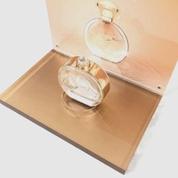 Porte-bouteilles de parfum cosmétique en acrylique de luxe Présentoir de point de vente de grand magasin de beauté en or rose avec affiche modifiable