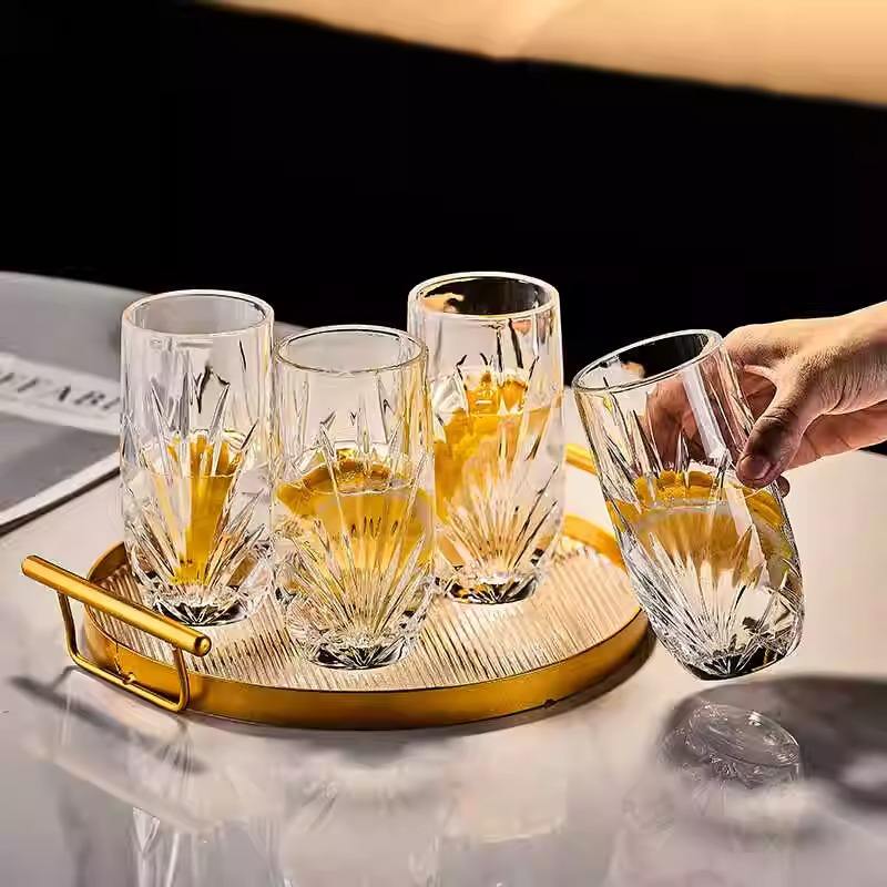 Several tall drinking glasses with textured surface patterns