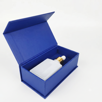 Étui rigide en carton noir obsidienne de luxe avec doublure en feuille d'aluminium pour l'emballage de whisky et de champagne haut de gamme