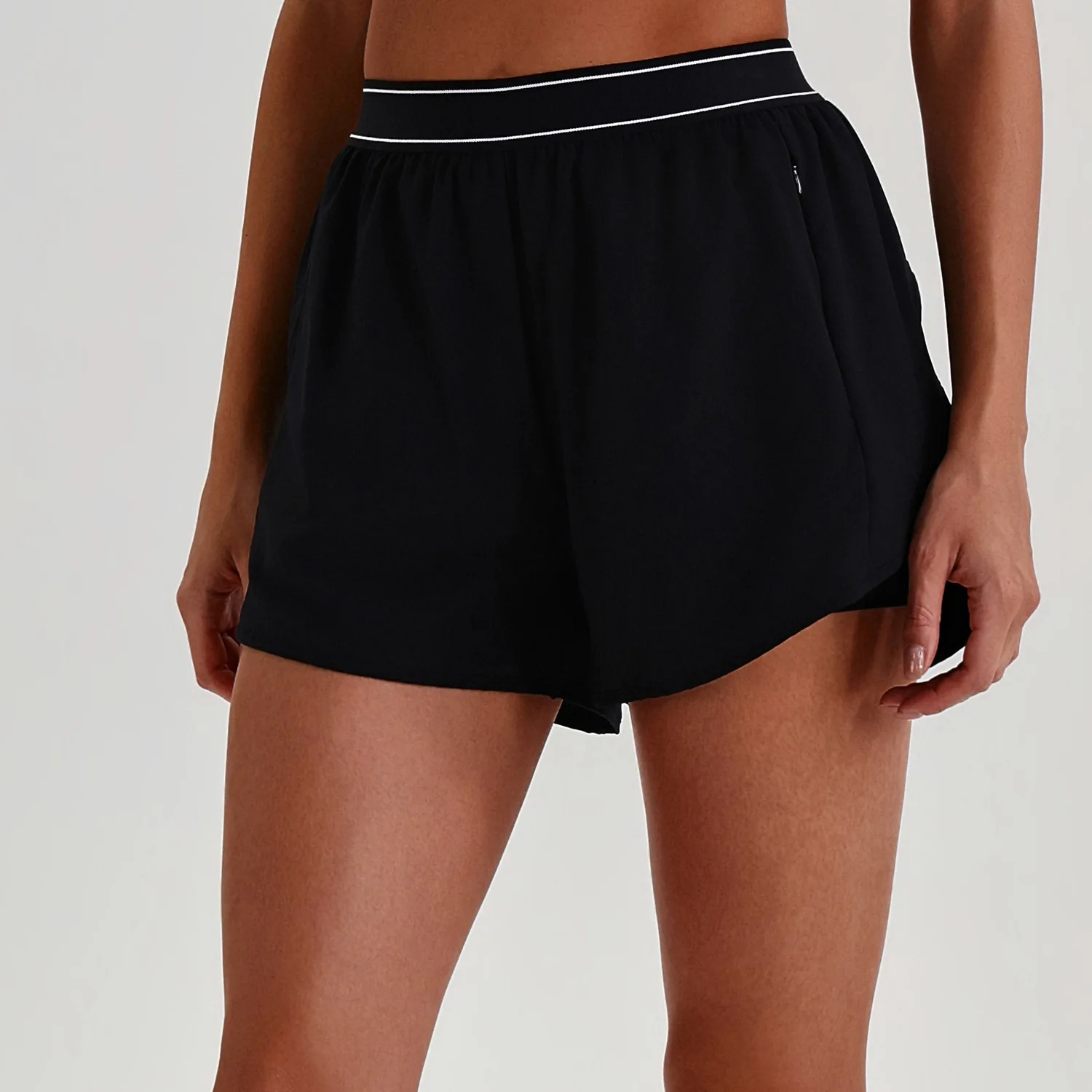 High-Waist Activewear Pants: fabric, pocket and construction detail