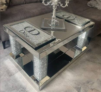 Table basse de style européen en acier inoxydable avec plateau en verre à surface perforée, luxe discret et design simple, pour salon