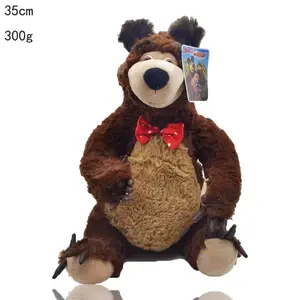 Muñecas rusas con ojos grandes y patas marrones con uñas largas y corbata roja, juguete de oso