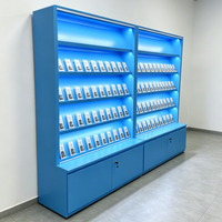 Étagère de présentation moderne avec rétroéclairage LED bleu, vitrine multi-niveaux avec base verrouillable pour produits de tabac/produits pharmaceutiques