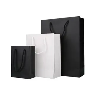 Tas belanja tas kertas hadiah mewah dengan pegangan kustom kertas pakaian mudah terurai menerima kertas Kraft hitam putih