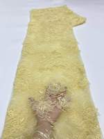 Tissu en dentelle brodée florale colorée avec des paillettes perlées, décoration élégante et luxueuse pour vêtements