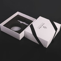 Boîtes d'emballage élégantes personnalisées d'ensemble de soins de la peau en papier carton noir et blanc pour l'emballage de produits de soin