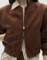 Blouson aviateur en laine naturelle pour femmes doublure en peau de mouton fermeture à glissière tissé motif solide manteau d'hiver durable longueur courte