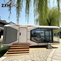 Capsule spatiale avec panneaux muraux en charbon de bambou et éclairage intérieur et extérieur, maison capsule modulaire pour complexe hôtelier