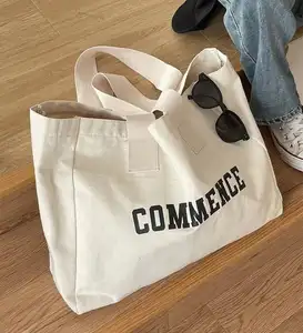 Bolsos de mano de mujer populares impresos con logotipo personalizado bolsos de compras de lona de algodón orgánico liso con cremallera y bolsillo