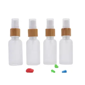 High quality 1 oz 1/2 oz 1 3oz 2 oz 4 oz frosted bamboo cap empty cream boston round pump spray glass bottles for cosmetics