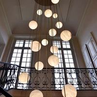Lustre long en cristal pour escalier, style chinois moderne, rotatif et ajouré, pour hôtel, villa, duplex, loft, lampe d'escalier simple et moderne