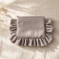 Pochette en velours côtelé à volants pour l'automne et l'hiver, pochette de maquillage en tissu de couleur unie, sac de rangement cosmétique portable pour les voyages et les sorties