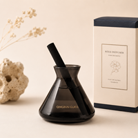 Diffuseur de parfum en verre coloré en gros avec bâtonnets noirs pour hôtels, spas et présentations de cadeaux