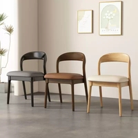 Chaise de salle à manger moderne à dossier incurvé en bois de caoutchouc massif, finition ton noyer, coussin aspect cuir cognac, fournisseur en gros