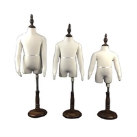 Mannequin d'enfants de mode avec les bras en bois et le mannequin d'affichage de tissu de haut du corps de tête à vendre