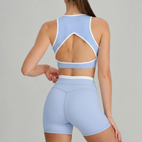 Ensemble de sport pour femme doux et très élastique, avec brassière de sport à dos découpé et blocs de couleur, et short cycliste moulant, pour le yoga, le Pilates et la course à pied