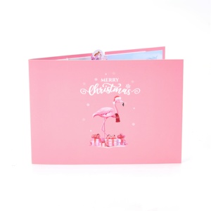 Tarjeta de Felicitación 3D Pop-up con Tema de Papá Noel y Flamencos, con un Lujoso y Fantástico Árbol de Navidad Rosa y una Pila de Regalos Rosados - Product Image 4