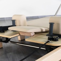 Vente en gros de Reformers Pilates pliables en bois écologique pour l'entraînement à domicile, machine de Pilates pliable commerciale