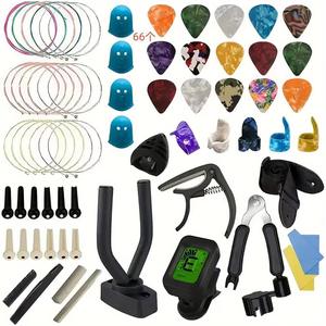 Juego al por mayor de accesorios para instrumentos musicales, <span class=keywords><strong>cambiador</strong></span> de cuerdas de guitarra, sintonizador Capo en <span class=keywords><strong>silicona</strong></span> ABS, herramientas completas para instrumentos - Product Image 1