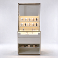 Vitrine d'exposition de montres avec cadre doré, éclairage LED, supports en acrylique, tiroirs et étagère ouverte, certifiée CE ETL, pour les boutiques de montres