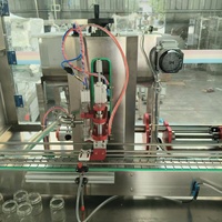 Machine de remplissage automatique de liquides visqueux, machine de remplissage à piston entièrement automatique de type linéaire à tête unique avec mélangeur