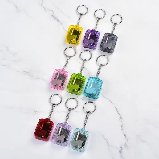 Wholesale and best-selling transparent acrylic Spring Wound Mini music box key chain for girlfriend and children's toys