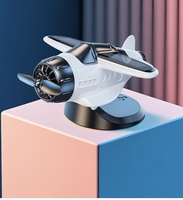 Avión giratorio alimentado por energía Solar, nuevos adornos creativos para coche para decoración de consola central, Material plástico al por mayor
