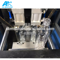 Machine de fabrication de bouteilles en plastique AK 31 Pakistan / Machine de soufflage de bouteilles de 20 litres / Moulage par injection de bouchons de bouteilles