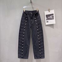 Le nouveau style d'automne américain : jeans à boutons côtelés en métal vieilli, coupe ample et courbée, pantalons à jambes larges et pantalons longs.