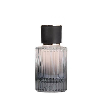Flacon de parfum en verre à rayures verticales noir de luxe 50 ml avec bouchon rond et atomiseur, conteneur vide pour cosmétiques