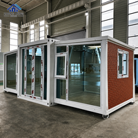 Porte pliante en verre à cadre en acier à motif de briques en bois personnalisé, maison conteneur modulaire préfabriquée à double aile extensible