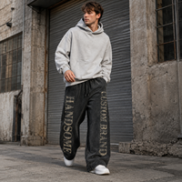Pantalon de survêtement homme en molleton bouclette coupe large, effet délavé, taille à cordon, imprimé sérigraphié, style streetwear décontracté, marque privée