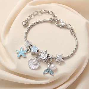 Pulsera de dijes con cuentas estilo marino, con colgantes esmaltados de estrella de mar, cola de sirena y delfín, ajustable, joyería DIY para mujeres y niñas - Product Image 4