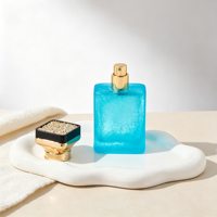 Flacon de parfum en verre bleu 50ml 1.7oz, texture craquelée, col doré, bouchon rectangulaire noir et or, vente en gros, approvisionnement en vrac
