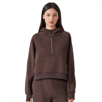 Nouveau sweat-shirt de sport de yoga ample à demi-zip à capuche pour femme en polyester/coton doublé de polaire anti-rides