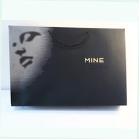 Sacs en papier noir écologiques avec impression argentée et dorée en relief UV, élégants pour les vêtements, les chaussures, les achats et les cadeaux